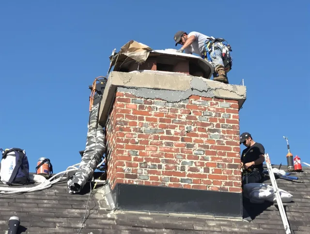 Newark Chimney Sweep installing a custom chimney crown in Newark, OH