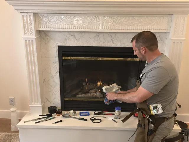 Newark Chimney Sweep performing fireplace maintenance in Newark, OH