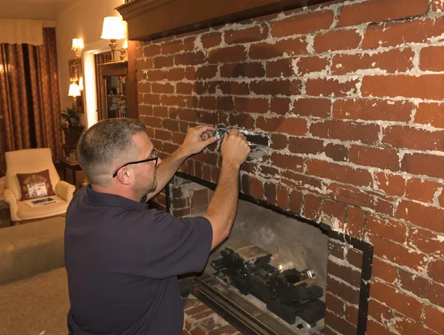 Newark Chimney Sweep expert fixing a fireplace in Newark, OH